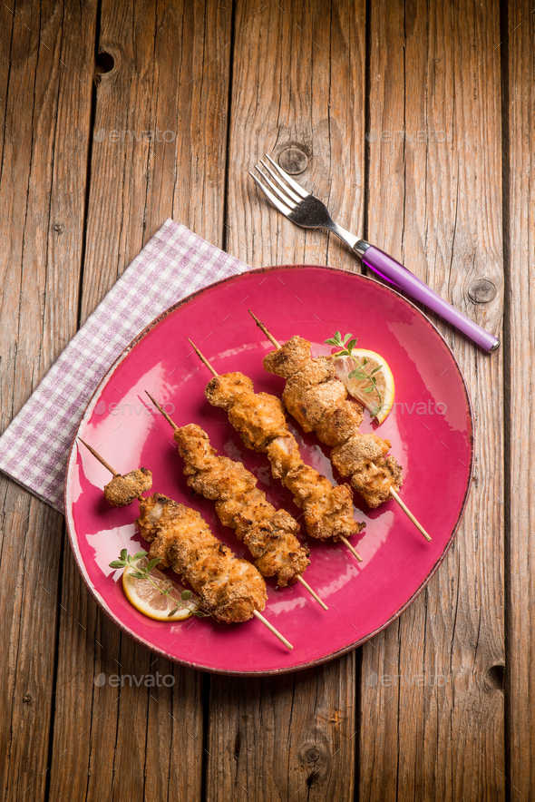 sword fish skewer with lemon and parsley Stock Photo by